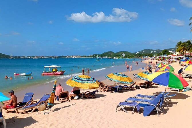 St. Lucia Beach Day with Paradise Beach Comforts & Transportation - Sunbeds, Umbrellas, and a Complimentary Drink
